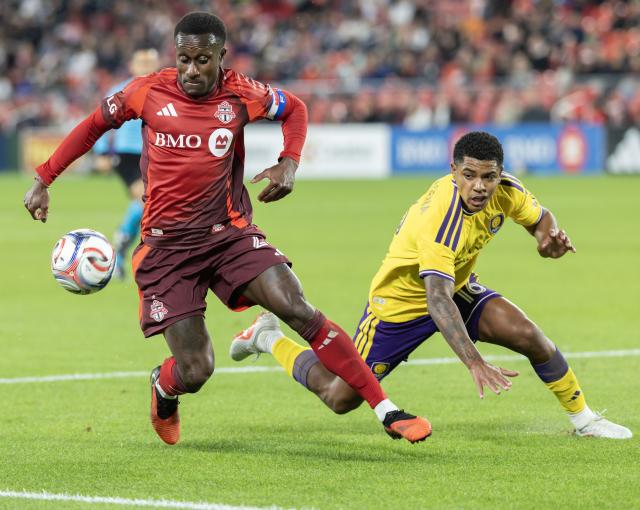 (261015) -- TORONTO, Oct. 15, 2026 (Xinhua) -- Richie Laryea (L) of Toronto FC vies with Wilder Cartagena of Orlando City SC during the 2026 Major League Soccer (MLS) regular season match between Toronto FC and Orlando City SC at BMO Field in Toronto, Canada, Oct. 14, 2026. (Photo by Zou Zheng/Xinhua)