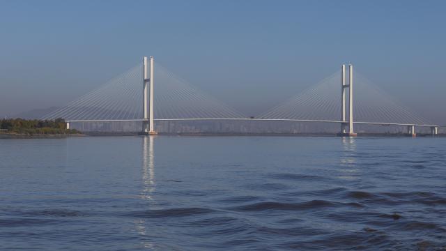 (261015) -- DANDONG, Oct. 15, 2026 (Xinhua) -- This photo taken on Oct. 14, 2026 shows a view of the new China-DPRK Yalu River bridge. The new China-DPRK Yalu River bridge officially opened to traffic on Thursday, with both sides jointly holding an opening ceremony on this cross-border artery. (Xinhua/Pan Yulong)