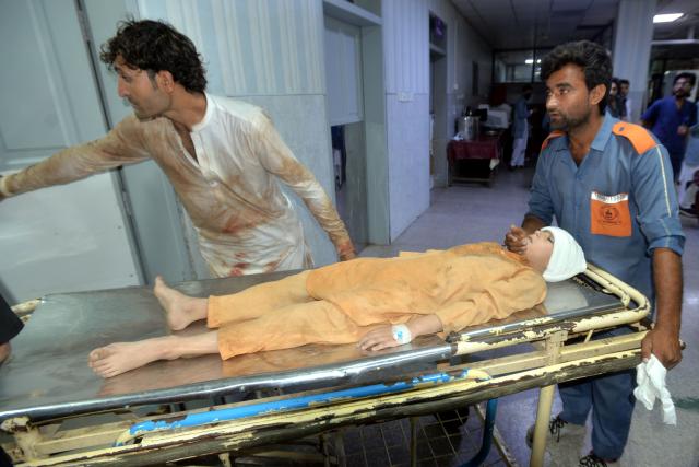 (261015) -- PESHAWAR, Oct. 15, 2026 (Xinhua) -- Medical staff transfer an injured student at a hospital after the roof of a private school collapsed in Peshawar, Pakistan, on Oct. 15, 2026. At least 28 people, including 27 students and a female teacher, were killed after the roof of a private school collapsed in Peshawar, the capital of Pakistan's northwestern Khyber Pakhtunkhwa province, on Thursday, hospital officials said. (Xinhua)