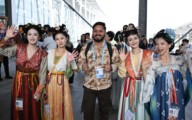 (261015) -- GUANGZHOU, Oct. 15, 2026 (Xinhua) -- An overseas buyer poses for photos during the Canton Fair in Guangzhou, south China's Guangdong Province, Oct. 15, 2026. The 140th edition of the China Import and Export Fair, also known as the Canton Fair, opened to visitors in Guangzhou, capital of south China's Guangdong Province on Thursday, with more than 30,000 exhibiting companies and about 340,000 overseas buyers expected to attend.
The 140th Canton Fair runs in three phases in Guangzhou from Oct. 15 to Nov. 4.
Over the past 70 years, the Canton Fair has grown into China's largest and longest-running international trade event, with the most complete product range, the largest number of buyers and the highest transaction volume. (Xinhua/Deng Hua)