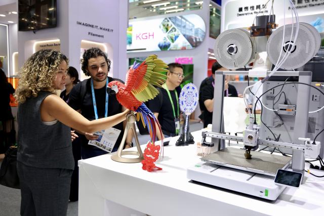 (261015) -- GUANGZHOU, Oct. 15, 2026 (Xinhua) -- Overseas buyers view 3D-printed exhibits during the Canton Fair in Guangzhou, south China's Guangdong Province, Oct. 15, 2026. The 140th edition of the China Import and Export Fair, also known as the Canton Fair, opened to visitors in Guangzhou, capital of south China's Guangdong Province on Thursday, with more than 30,000 exhibiting companies and about 340,000 overseas buyers expected to attend.
The 140th Canton Fair runs in three phases in Guangzhou from Oct. 15 to Nov. 4.
Over the past 70 years, the Canton Fair has grown into China's largest and longest-running international trade event, with the most complete product range, the largest number of buyers and the highest transaction volume. (Xinhua/Lu Hanxin)