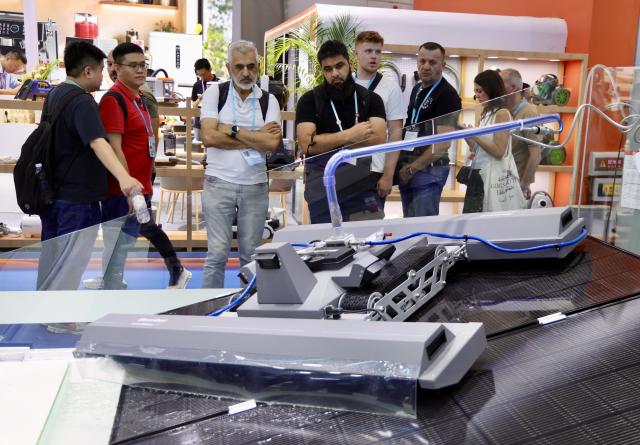 (261015) -- GUANGZHOU, Oct. 15, 2026 (Xinhua) -- Overseas buyers view a solar panel cleaner during the Canton Fair in Guangzhou, south China's Guangdong Province, Oct. 15, 2026. The 140th edition of the China Import and Export Fair, also known as the Canton Fair, opened to visitors in Guangzhou, capital of south China's Guangdong Province on Thursday, with more than 30,000 exhibiting companies and about 340,000 overseas buyers expected to attend.
The 140th Canton Fair runs in three phases in Guangzhou from Oct. 15 to Nov. 4.
Over the past 70 years, the Canton Fair has grown into China's largest and longest-running international trade event, with the most complete product range, the largest number of buyers and the highest transaction volume. (Xinhua/Lu Hanxin)