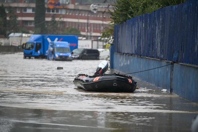 (261015) -- ISTANBUL, Oct. 15, 2026 (Xinhua) -- A rescue boat is seen on a flooded road in Sariyer district, Istanbul, Türkiye, Oct. 15, 2026. Two people died in Istanbul after torrential rain triggered flash floods, with rainfall reaching nearly 200 kg per square meter, authorities said Thursday. (Xinhua/Liu Lei)
