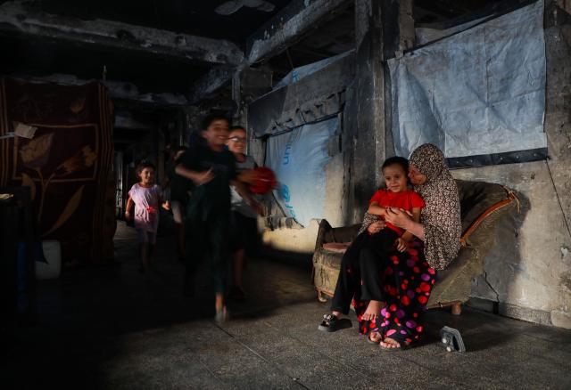 (261015) -- GAZA, Oct. 15, 2026 (Xinhua) -- Displaced Palestinians are pictured in Jabalia refugee camp, northern Gaza Strip, on Oct. 14, 2026. (Photo by Rizek Abdeljawad/Xinhua)