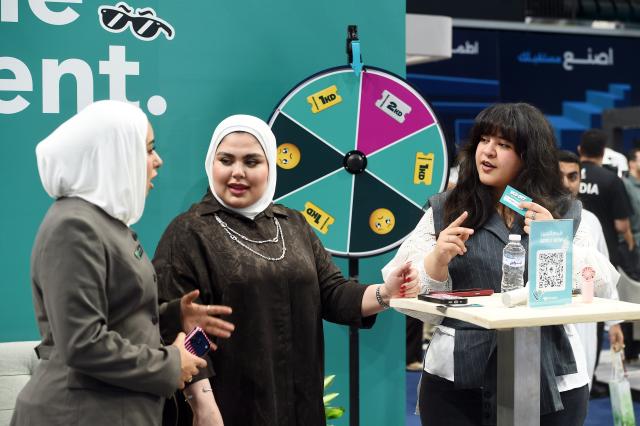 (261015) -- HAWALLI GOVERNORATE, Oct. 15, 2026 (Xinhua) -- People visit the Watheefti career fair in Hawalli Governorate, Kuwait, Oct. 15, 2026. The Watheefti 2026 career fair opened in Kuwait's Hawalli Governorate on Thursday, bringing together more than 120 companies and organizations from various sectors. The three-day event, running through to Oct. 17, aims to connect jobseekers with potential employers, offer career guidance and training opportunities. (Photo by Asad/Xinhua)