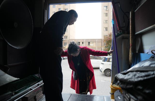 (261015) -- SHENYANG, Oct. 15, 2026 (Xinhua) -- Xu Zilin (L) and his wife get off a vehicle that serves as the mobile stage for their shadow puppetry performance in Lingyuan City, northeast China's Liaoning Province, Oct. 10, 2026.
  Lingyuan shadow puppetry, a national-level intangible cultural heritage in China, comes vividly alive amid dazzling light and shadow. Movements of the puppets embody the local folk traditions, which have been passed down through generations.
  Xu Zilin was born in 1964 to a family that has the Lingyuan shadow puppetry as its walk of life for ages. More than 40 years of professional experience made Xu a representative inheritor of the craft and an influential figure in the trade. Many of his vocal passages have been modeled for teaching.
  To better promote shadow plays, Xu founded a shadow puppetry troupe and brought quality productions to the grassroots level. Over the years, Xu and his troupe have performed more than 4,000 shows in Liaoning and neighboring provinces. (Xinhua/Li Gang)