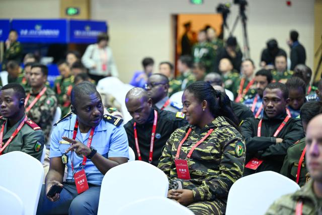 (261015) -- BEIJING, Oct. 15, 2026 (Xinhua) -- Participants communicate with each other during the Great Wall-2026 International Forum on Counter-Terrorism in Beijing, capital of China, Oct. 14, 2026. The Great Wall-2026 International Forum on Counter-Terrorism concluded here on Thursday. (Photo by Yue Chang/Xinhua)