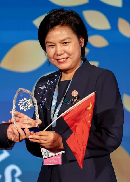 (261015) -- ROME, Oct. 15, 2026 (Xinhua) -- Yu Jinxiu attends a ceremony for Food and Agriculture Organization of the United Nations' (FAO) 100 Women Heroes in Agrifood Systems and Rural Development, in Rome, Italy, Oct. 15, 2026. Yu is a moxibustion therapist from Qichun County in central China's Hubei Province. Yu Jinxiu and Dong Minfang were named among the FAO's 100 Women Heroes in Agrifood Systems and Rural Development, a global recognition initiative launched by the FAO. They have spent years sharing their expertise to help thousands of people secure jobs and start businesses, raising incomes for rural residents.
  The United Nations designated 2026 as the International Year of the Woman Farmer to highlight women's contribution to agrifood systems and promote policies and investments that improve their access to finance, knowledge and services. (Xinhua/Wang Kaiyan)