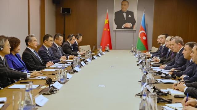 (261015) -- BAKU, Oct. 15, 2026 (Xinhua) -- Chinese Foreign Minister Wang Yi, also a member of the Political Bureau of the Communist Party of China Central Committee, holds talks with Azerbaijani Foreign Minister Jeyhun Bayramov in Baku, Azerbaijan, Oct. 15, 2026. (Xinhua/Chen Junfeng)