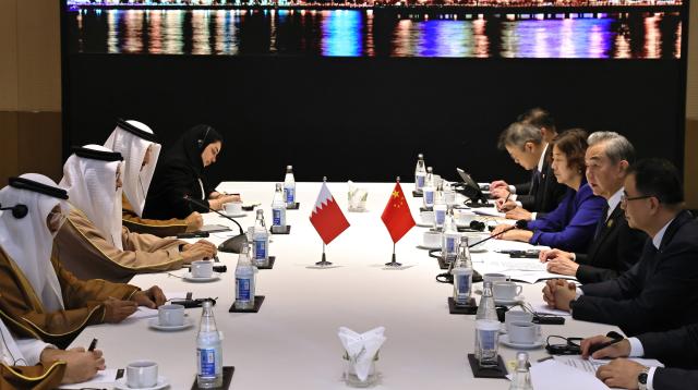 (261015) -- BAKU, Oct. 15, 2026 (Xinhua) -- Chinese Foreign Minister Wang Yi, also a member of the Political Bureau of the Communist Party of China Central Committee, meets with Bahraini Foreign Minister Abdullatif bin Rashid Al Zayani on the sidelines of the Seventh Summit of the Conference on Interaction and Confidence Building Measures in Asia, in Baku, Azerbaijan, Oct. 15, 2026. (Xinhua/Chen Junfeng)