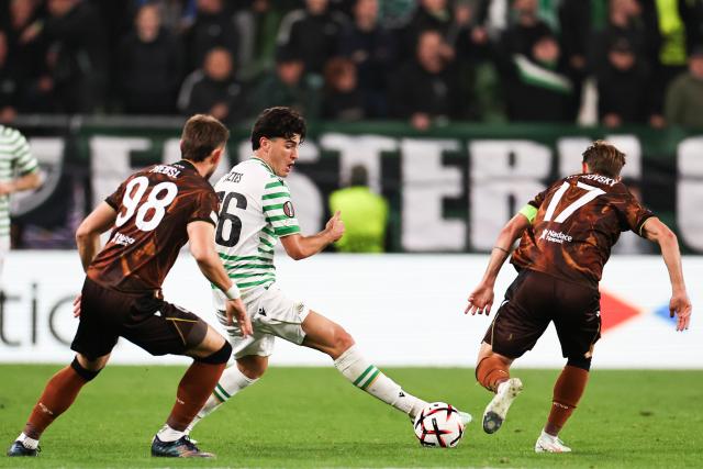 (261016) -- BUDAPEST, Oct. 16, 2026 (Xinhua) -- Krisztian Lisztes (C) of Ferencvaros vies with Patrik Hrosovsky (R) of Viktoria Plzen during the UEFA Europa League 2026/27 League Phase match between Ferencvaros and Viktoria Plzen in Budapest, Hungary, Oct. 15, 2026. (Xinhua/Hu Zhixuan)