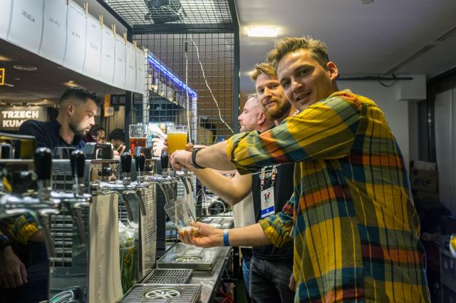 (261016) -- WARSAW, Oct. 16, 2026 (Xinhua) -- A staff member pours a glass of beer from a tap at the 22nd Warsaw Beer Festival in Warsaw, Poland, Oct. 15, 2026. The festival runs from Oct. 15 to 17 at Legia Warsaw Stadium, featuring beer tastings, food trucks, workshops and live music. Launched in 2014, the festival is held every spring and autumn. (Photo by Jaap Arriens/Xinhua)