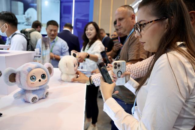 (261016) -- GUANGZHOU, Oct. 16, 2026 (Xinhua) -- An overseas buyer learns about a companion robot during the Canton Fair in Guangzhou, south China's Guangdong Province, Oct. 15, 2026. The 140th edition of the China Import and Export Fair, also known as the Canton Fair, opened to visitors in Guangzhou, capital of south China's Guangdong Province on Thursday, with more than 30,000 exhibiting companies and about 340,000 overseas buyers expected to attend.
  Serving as a barometer and wind vane of China's foreign trade, this year's fair, marking its 70th anniversary, features innovation, intelligence, greater specialization and higher quality.
  The Canton Fair is one of the world's few one-stop trade platforms offering a complete range of products with convenience and efficiency, while bringing together the latest products and technologies. (Xinhua/Lu Hanxin)