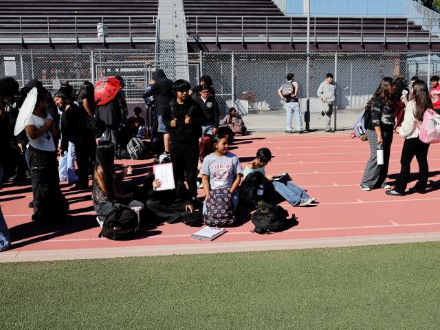 (261016) -- LOS ANGELES, Oct. 16, 2026 (Xinhua) -- Teachers and students evacuate to the school stadium during the "Great California ShakeOut," an annual statewide earthquake preparedness drill, at John C. Fremont High School in Los Angeles, California, the United States, Oct. 15, 2026. (Photo by Qiu Chen/Xinhua)