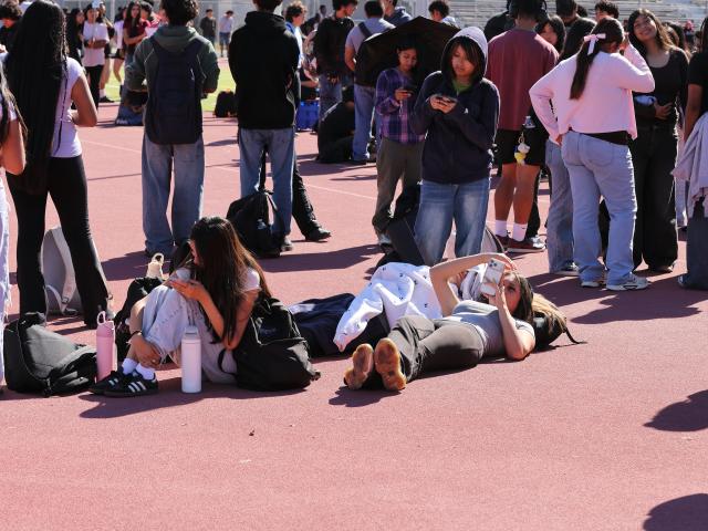 (261016) -- LOS ANGELES, Oct. 16, 2026 (Xinhua) -- Teachers and students evacuate to the school stadium during the "Great California ShakeOut," an annual statewide earthquake preparedness drill, at John C. Fremont High School in Los Angeles, California, the United States, Oct. 15, 2026. (Photo by Qiu Chen/Xinhua)