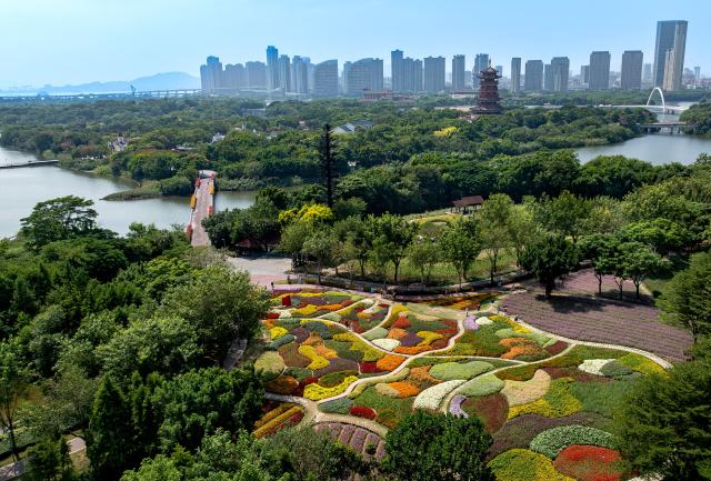 (261016) -- XIAMEN, Oct. 16, 2026 (Xinhua) -- An aerial drone photo taken on Oct. 16, 2026 shows an autumn view at Xiamen Horticulture Expo Garden in Xiamen, southeast China's Fujian Province. (Xinhua/Wei Peiquan)