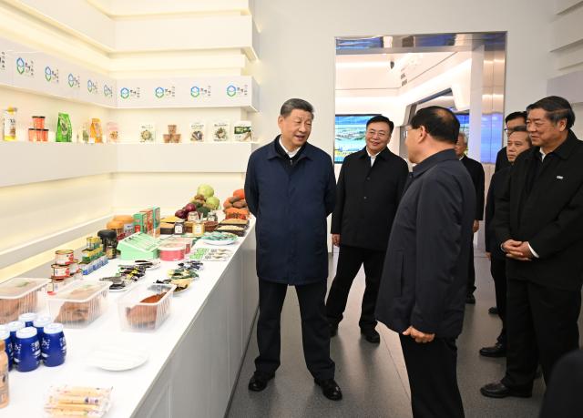 (261016) -- ULANQAB, Oct. 16, 2026 (Xinhua) -- Chinese President Xi Jinping, also general secretary of the Communist Party of China Central Committee and chairman of the Central Military Commission, views displays of local agricultural and livestock specialties while visiting Chahar High Tech Development Zone in Ulanqab, north China's Inner Mongolia Autonomous Region, Oct. 16, 2026. Xi made an inspection trip on Friday to the city of Ulanqab, north China's Inner Mongolia Autonomous Region. (Xinhua/Xie Huanchi)
