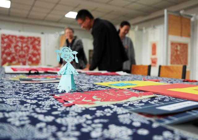 (261016) -- CHAOYANG, Oct. 16, 2026 (Xinhua) -- This photo taken on Oct. 10, 2026 shows Yang Zhihong's papercut works at an art exhibition hall in Jianping County of Chaoyang City, northeast China's Liaoning Province. Known for its bold, rustic style and designs inspired by folk stories and traditional symbols, Jianping paper-cutting reflects the rich culture of western Liaoning Province.
   Born in 1972, Yang Zhihong is a representative inheritor of Jianping paper-cutting, a provincial-level intangible cultural heritage of Liaoning Province. Inspired by local folk artists from an early age, she has devoted herself to preserving this traditional art. 
   Over decades of practice, Yang has won several major industry awards. Today, she continues to explore the art's cultural heritage and create new works, keeping this ancient folk tradition alive. (Xinhua/Li Gang)