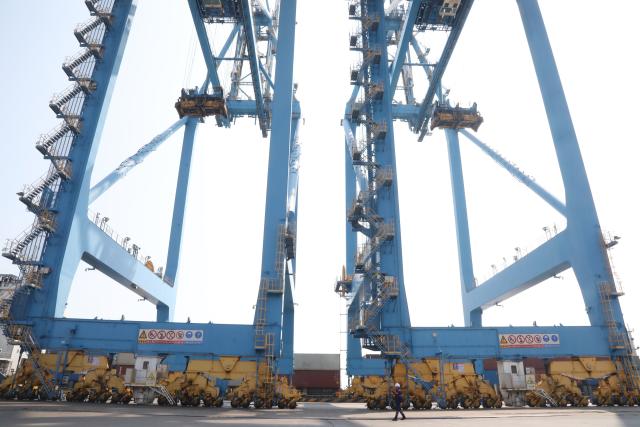 (261016) -- BEIHAI, Oct. 16, 2026 (Xinhua) -- This photo taken on Oct. 15, 2026 shows a terminal of Tieshan Port in Beihai, south China's Guangxi Zhuang Autonomous Region. Taking advantage of its ports, resources as well as geographical location, Beihai has in recent years focused on developing eight pillar industries such as green chemicals, metal materials, information technology, and marine engineering equipment. It is accelerating the building of a modern and ocean-oriented industrial system featuring intelligence, greenness and integration. (Xinhua/Lu Peng)