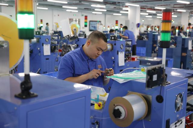 (261016) -- BEIHAI, Oct. 16, 2026 (Xinhua) -- A staff member works at a workshop of Yongxing Tech in Beihai, south China's Guangxi Zhuang Autonomous Region, Oct. 16, 2026. Taking advantage of its ports, resources as well as geographical location, Beihai has in recent years focused on developing eight pillar industries such as green chemicals, metal materials, information technology, and marine engineering equipment. It is accelerating the building of a modern and ocean-oriented industrial system featuring intelligence, greenness and integration. (Xinhua/Lu Peng)