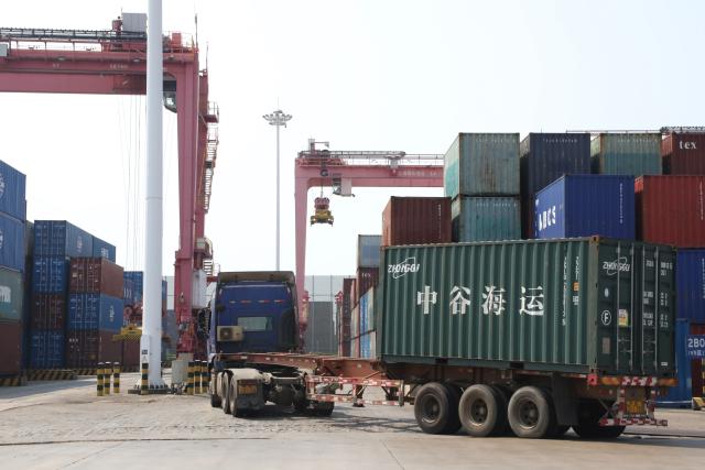 (261016) -- BEIHAI, Oct. 16, 2026 (Xinhua) -- This photo taken on Oct. 15, 2026 shows a terminal of Tieshan Port in Beihai, south China's Guangxi Zhuang Autonomous Region. Taking advantage of its ports, resources as well as geographical location, Beihai has in recent years focused on developing eight pillar industries such as green chemicals, metal materials, information technology, and marine engineering equipment. It is accelerating the building of a modern and ocean-oriented industrial system featuring intelligence, greenness and integration. (Xinhua/Lu Peng)