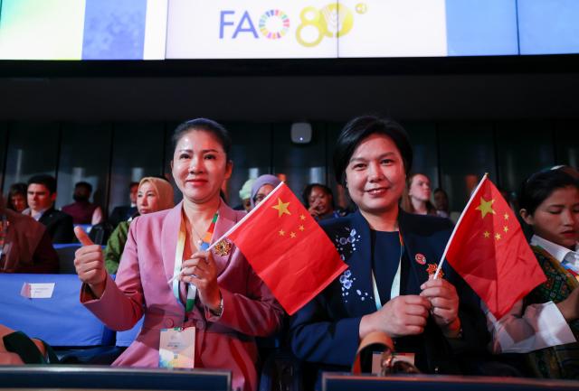 (261016) -- ROME, Oct. 16, 2026 (Xinhua) -- Dong Minfang (L) and Yu Qiujin, honorees of Food and Agriculture Organization of the United Nations (FAO)'s 100 Women Heroes in Agrifood Systems and Rural Development, attend the World Food Day ceremony at the FAO headquarter in Rome, Italy, Oct. 16, 2026. (Xinhua/Wang Kaiyan)