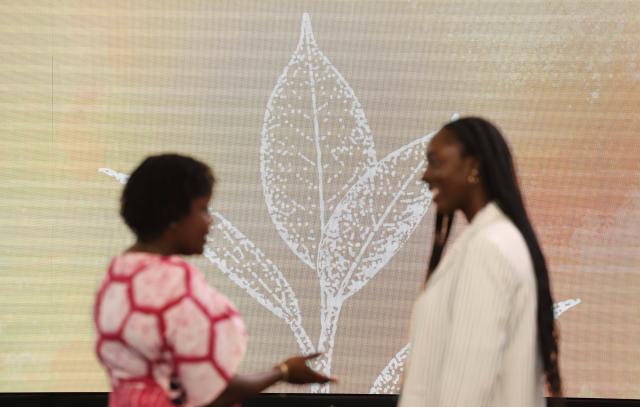 (261016) -- ROME, Oct. 16, 2026 (Xinhua) -- People chat before the World Food Day ceremony at the headquarter of Food and Agriculture Organization of the United Nations (FAO) in Rome, Italy, Oct. 16, 2026. (Xinhua/Wang Kaiyan)