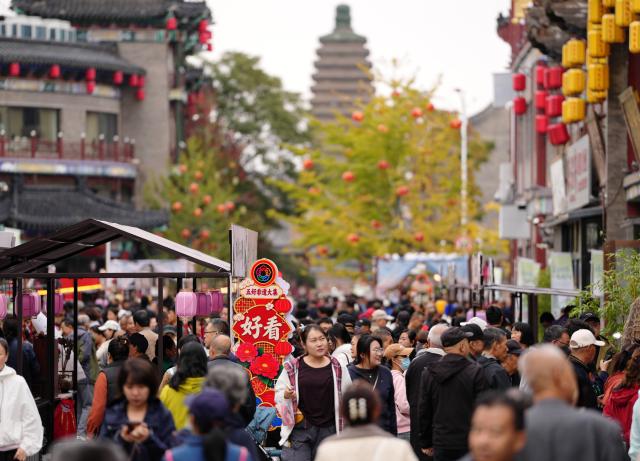 (261017) -- CHAOYANG, Oct. 17, 2026 (Xinhua) -- People visit an intangible cultural heritage fair, a supporting event of the 4th annual conference on intangible cultural heritage safeguarding in China, in Chaoyang, northeast China's Liaoning Province, Oct. 16, 2026. The three-day annual conference hosts multiple cultural activities, allowing the public to feel the charm of intangible cultural heritage up close. (Xinhua/Li Gang)