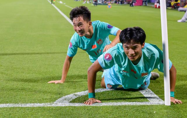 (261017) -- DOHA, Oct. 17, 2026 (Xinhua) -- Liu Yuyang (R) of China celebrates after scoring during the Gulf Football Federation (GFF) Gulf Cup U-17 Qatar 2026 football match between Qatar and China at Grand Hamad Stadium in Doha, Qatar, Oct. 16, 2026. (Photo by Nikku/Xinhua)