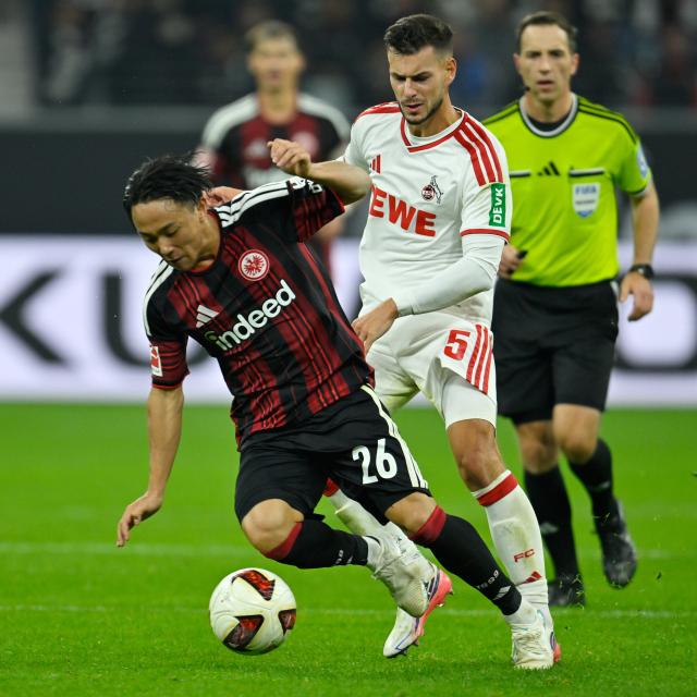 (261017) -- FRANKFURT, Oct. 17, 2026 (Xinhua) -- Kosugi Keita (L) of Eintracht Frankfurt vies with Tom Krauss of FC Cologne during the German first division Bundesliga football match between Eintracht Frankfurt and FC Cologne in Frankfurt, Germany, Oct. 16, 2026. (Photo by Ulrich Hufnagel/Xinhua)