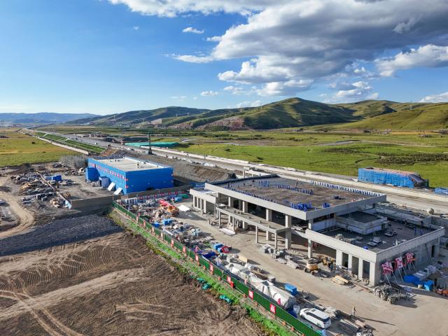 (261017) -- CHENGDU, Oct. 17, 2026 (Xinhua) -- An aerial drone photo taken on Sept. 2, 2026 shows the construction site of the Hongyuan Station along the Xining-Chengdu Railway in Hongyuan County of Aba Tibetan and Qiang Autonomous Prefecture, southwest China's Sichuan Province. TO GO WITH "Across China: A young returnee's bet on the 'sea of death'" (Xinhua/Wang Xi)