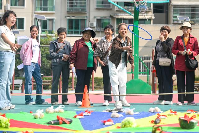 (261017) -- GUIYANG, Oct. 17, 2026 (Xinhua) -- The elderly participate in a fun game at a community of Wudang District in Guiyang, southwest China's Guizhou Province, Oct. 16, 2026. In recent years, Guizhou has been continuously improving its elderly care service system, with many places upgrading community-based elderly care service stations to provide heartwarming services such as community meal aid, free health consultations, and cultural and recreational activities. (Photo by Yuan Fuhong/Xinhua)