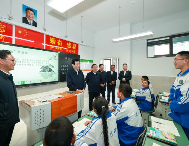 (261017) -- CHENGDU, Oct. 17, 2026 (Xinhua) -- Wang Huning, a member of the Standing Committee of the Political Bureau of the Communist Party of China Central Committee and chairman of the National Committee of the Chinese People's Political Consultative Conference, visits a secondary school in Sertar County of Garze Tibetan Autonomous Prefecture, southwest China's Sichuan Province, Oct. 14, 2026. Wang made an inspection tour in Chengdu, Deyang and the Garze Tibetan Autonomous Prefecture in southwest China's Sichuan Province from Oct. 13 to 16. (Xinhua/Liu Bin)