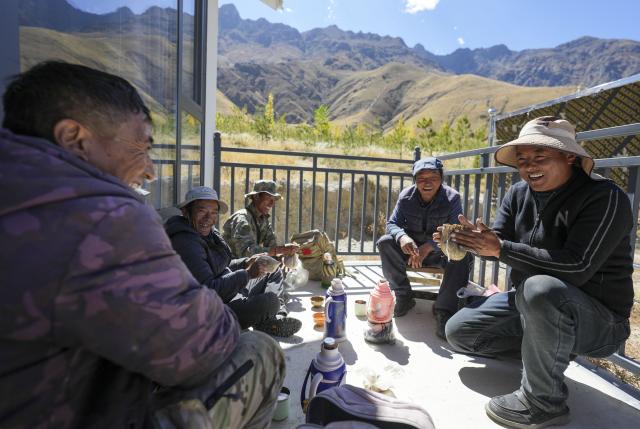 (261017) -- SHANNAN, Oct. 17, 2026 (Xinhua) -- Workers have lunch at a maintenance and protection station in the Shannan section of an afforestation project covering mountainous regions between Lhasa and Shannan, in Shannan City, southwest China's Xizang Autonomous Region, Oct. 17, 2026. In various areas of the Shannan section of this afforestation project, staff members have carried out forest and grassland fire prevention patrols, cleared flammable materials, opened firebreaks, and checked and repaired irrigation facilities to prepare for this year's first winter irrigation.
  The Shannan section of the project, which kicked off in 2022, has completed a total of 317,500 mu (about 21,166.67 hectares) of afforestation and generated more than 2.15 million jobs opportunities as of 2026. (Xinhua/Jigme Dorje)