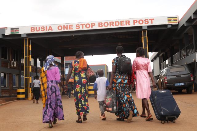 (261017) -- NAIROBI, Oct. 17, 2026 (Xinhua) -- Travelers prepare to enter Kenya through the One-Stop Border Post in Busia, Kenya, Oct. 16, 2026. Kenya's Ministry of Health on Saturday confirmed four new cases of Ebola Bundibugyo virus disease, bringing the total number of cases to seven, as efforts to prevent community transmission of the disease gathered pace. Kenya has stepped up Ebola screening and control measures at its border crossings. (Photo by John Okoyo/Xinhua)