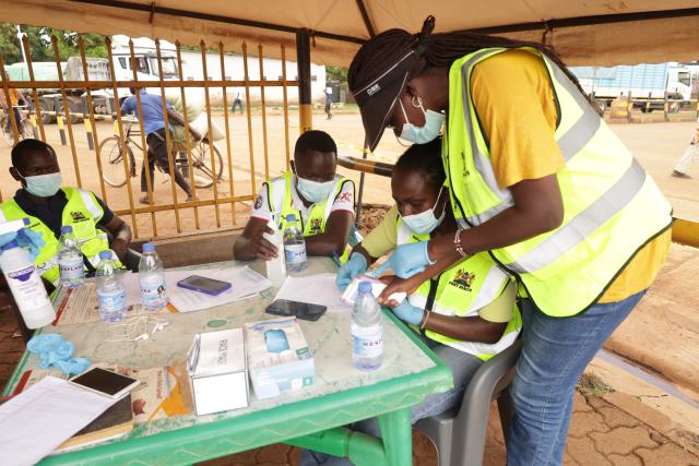 (261017) -- NAIROBI, Oct. 17, 2026 (Xinhua) -- Health officials work at the One-Stop Border Post in Busia, Kenya, Oct. 16, 2026. Kenya's Ministry of Health on Saturday confirmed four new cases of Ebola Bundibugyo virus disease, bringing the total number of cases to seven, as efforts to prevent community transmission of the disease gathered pace. Kenya has stepped up Ebola screening and control measures at its border crossings. (Photo by John Okoyo/Xinhua)