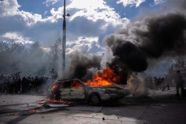 (261017) -- PARIS, Oct. 17, 2026 (Xinhua) -- Photo taken on Oct. 17, 2026 shows a burning vehicle during a protest in Paris, France. French Interior Minister Laurent Nunez said Saturday that about 550,000 people took part in the protests across France. According to French media reports, the demonstrations brought together farmers, climate activists, trade unions and students, expressing demands on fuel prices, the cost of living, education and public services. (Photo by Aurelien Morissard/Xinhua)