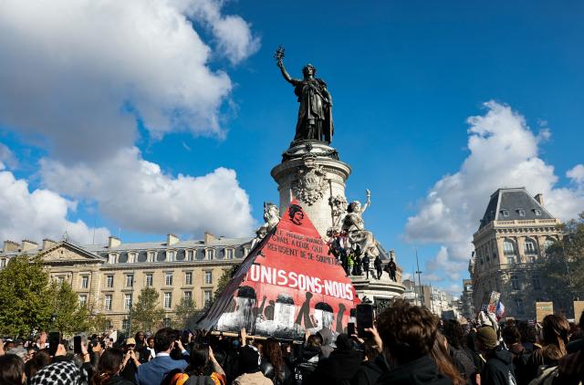 (261017) -- PARIS, Oct. 17, 2026 (Xinhua) -- People gather at Place de la Republique during a protest in Paris, France, Oct. 17, 2026. French Interior Minister Laurent Nunez said Saturday that about 550,000 people took part in the protests across France. According to French media reports, the demonstrations brought together farmers, climate activists, trade unions and students, expressing demands on fuel prices, the cost of living, education and public services. (Xinhua/Wu Huiwo)