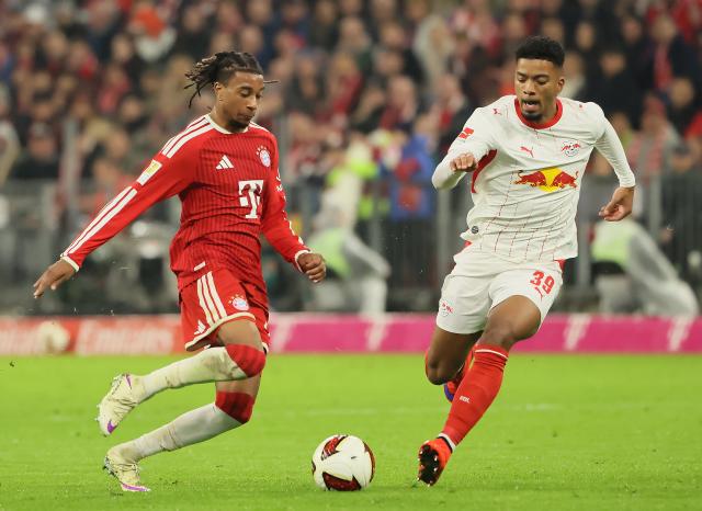 (261018) -- MUNICH, Oct. 18, 2026 (Xinhua) -- Michael Olise (L) of Bayern Munich vies with Benjamin Henrichs of RB Leipzig during the German first division Bundesliga football match between FC Bayern Munich and RB Leipzig in Munich, Germany, Oct. 17, 2026. (Photo by Philippe Ruiz/Xinhua)
