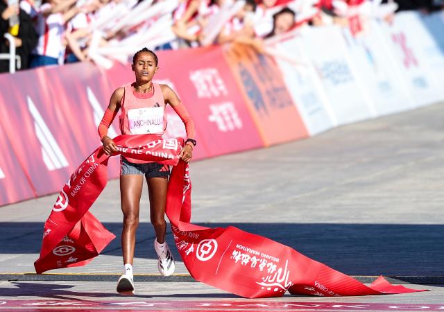 (261018) -- BEIJING, Oct. 18, 2026 (Xinhua) -- Anchinalu Dessie Genaneh of Ethiopia crosses the finish line to win the first place of the women's marathon event at the 2026 Beijing Marathon & National Marathon Championships in Beijing, capital of China, Oct. 18, 2026. (Xinhua/Luo Yuan)