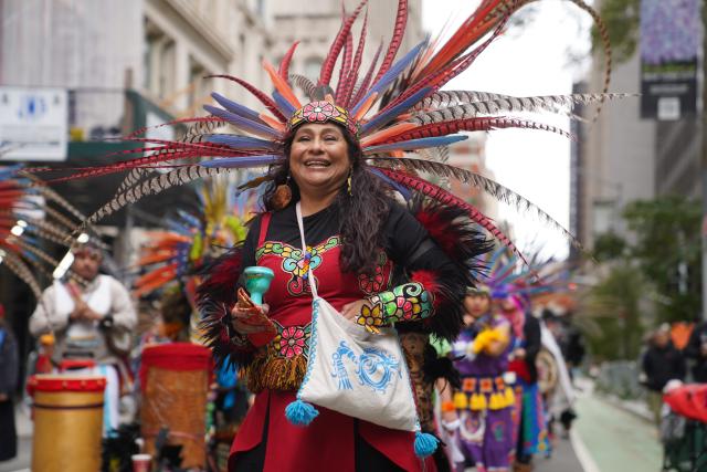 (261018) -- NEW YORK, Oct. 18, 2026 (Xinhua) -- People participate in a parade of indigenous people in New York, the United States, Oct. 17, 2026. The 5th Annual National Indigenous Peoples of the Americas Parade was held here on Saturday. (Xinhua/Zhang Fengguo)