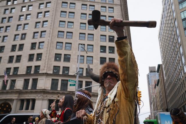(261018) -- NEW YORK, Oct. 18, 2026 (Xinhua) -- People participate in a parade of indigenous people in New York, the United States, Oct. 17, 2026. The 5th Annual National Indigenous Peoples of the Americas Parade was held here on Saturday. (Xinhua/Zhang Fengguo)