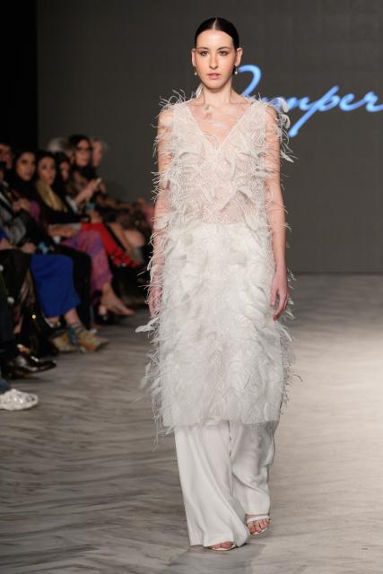 (261018) -- VANCOUVER, Oct. 18, 2026 (Xinhua) -- A model presents a creation by Chinese fashion designer Jumper Zhang during Vancouver Fashion Week 2026 in Vancouver, British Columbia, Canada, on Oct. 17, 2026. (Photo by Liang Sen/Xinhua)