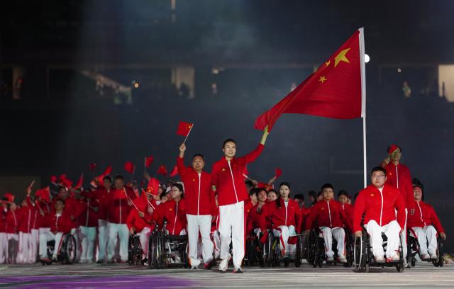 (261018) -- NAGOYA, Oct. 18, 2026 (Xinhua) -- The delegation of China parades into the stadium during the opening ceremony of the Aichi-Nagoya Asian Para Games in Nagoya, Japan, Oct. 18, 2026. (Xinhua/Jia Haocheng)