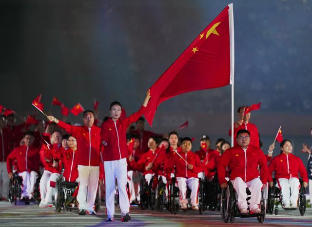 (261018) -- NAGOYA, Oct. 18, 2026 (Xinhua) -- The delegation of China parades into the stadium during the opening ceremony of the Aichi-Nagoya Asian Para Games in Nagoya, Japan, Oct. 18, 2026. (Xinhua/Jia Haocheng)
