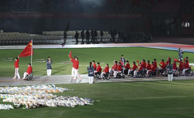 (261018) -- NAGOYA, Oct. 18, 2026 (Xinhua) -- The delegation of China parades into the stadium during the opening ceremony of the Aichi-Nagoya Asian Para Games in Nagoya, Japan, Oct. 18, 2026. (Xinhua/Yao Qilin)