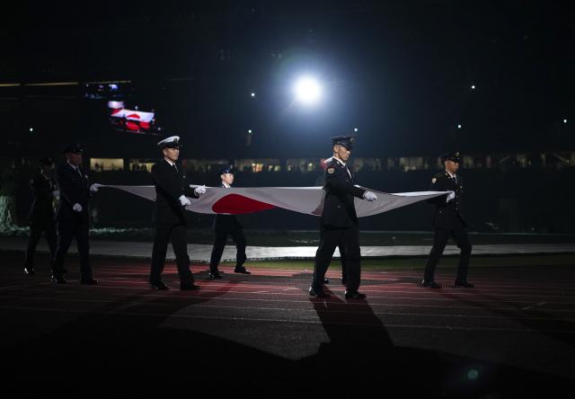 (261018) -- NAGOYA, Oct. 18, 2026 (Xinhua) -- The Japanese national flag is carried during the opening ceremony of the Aichi-Nagoya Asian Para Games in Nagoya, Japan, Oct. 18, 2026. (Xinhua/Jia Haocheng)