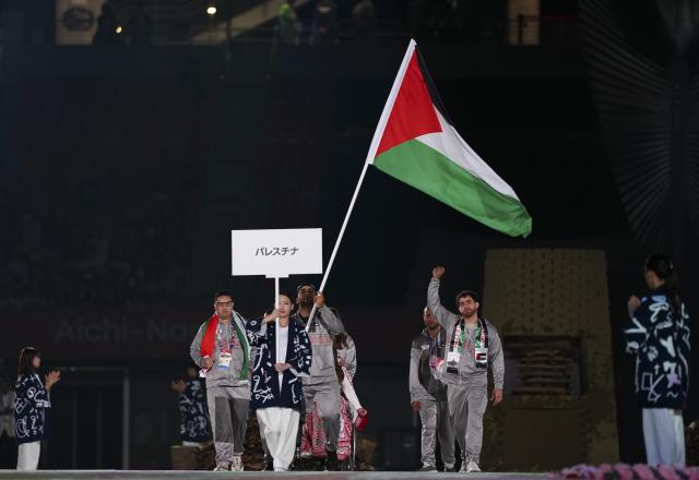 (261018) -- NAGOYA, Oct. 18, 2026 (Xinhua) -- The delegation of Palestine parades into the stadium during the opening ceremony of the Aichi-Nagoya Asian Para Games in Nagoya, Japan, Oct. 18, 2026. (Xinhua/Jia Haocheng)