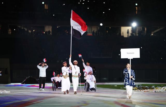 (261018) -- NAGOYA, Oct. 18, 2026 (Xinhua) -- The delegation of Yemen parades into the stadium during the opening ceremony of the Aichi-Nagoya Asian Para Games in Nagoya, Japan, Oct. 18, 2026. (Xinhua/Jia Haocheng)