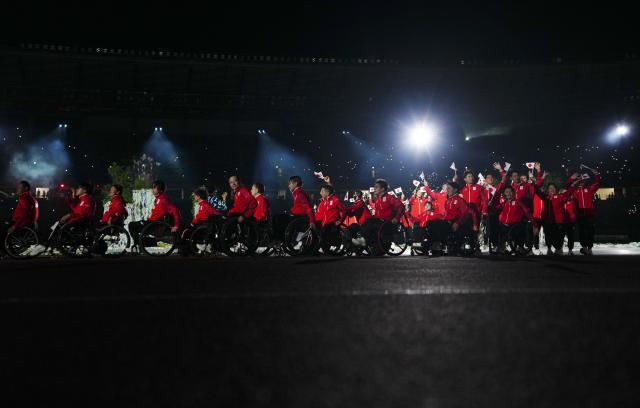(261018) -- NAGOYA, Oct. 18, 2026 (Xinhua) -- The delegation of Japan parades into the stadium during the opening ceremony of the Aichi-Nagoya Asian Para Games in Nagoya, Japan, Oct. 18, 2026. (Xinhua/Jia Haocheng)